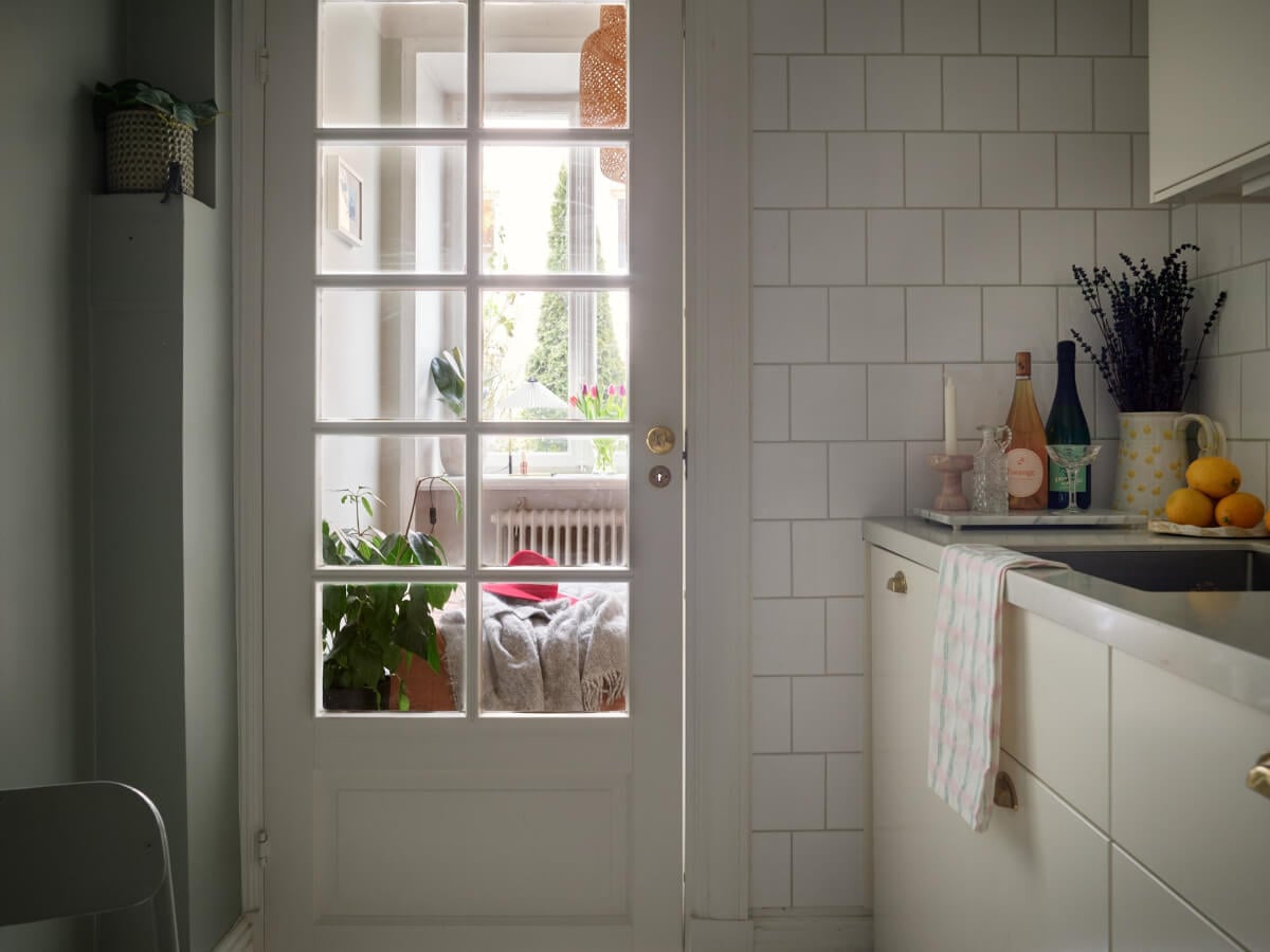 A Charming Small Apartment with a Fresh White Kitchen 14 kitchen glass door A Charming Small Apartment with a Fresh White Kitchen
