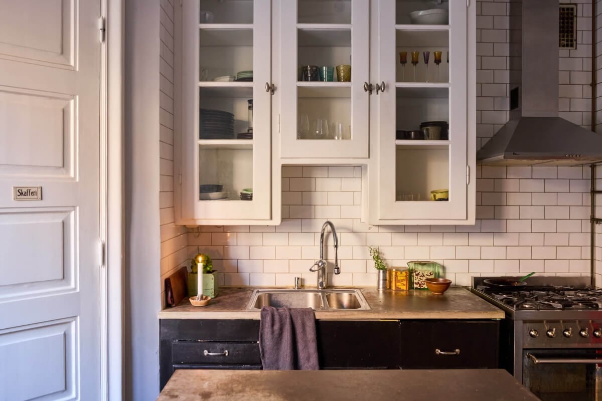 A Charming Apartment with Period Details in Malmö 12 kitchen glass front cabinets