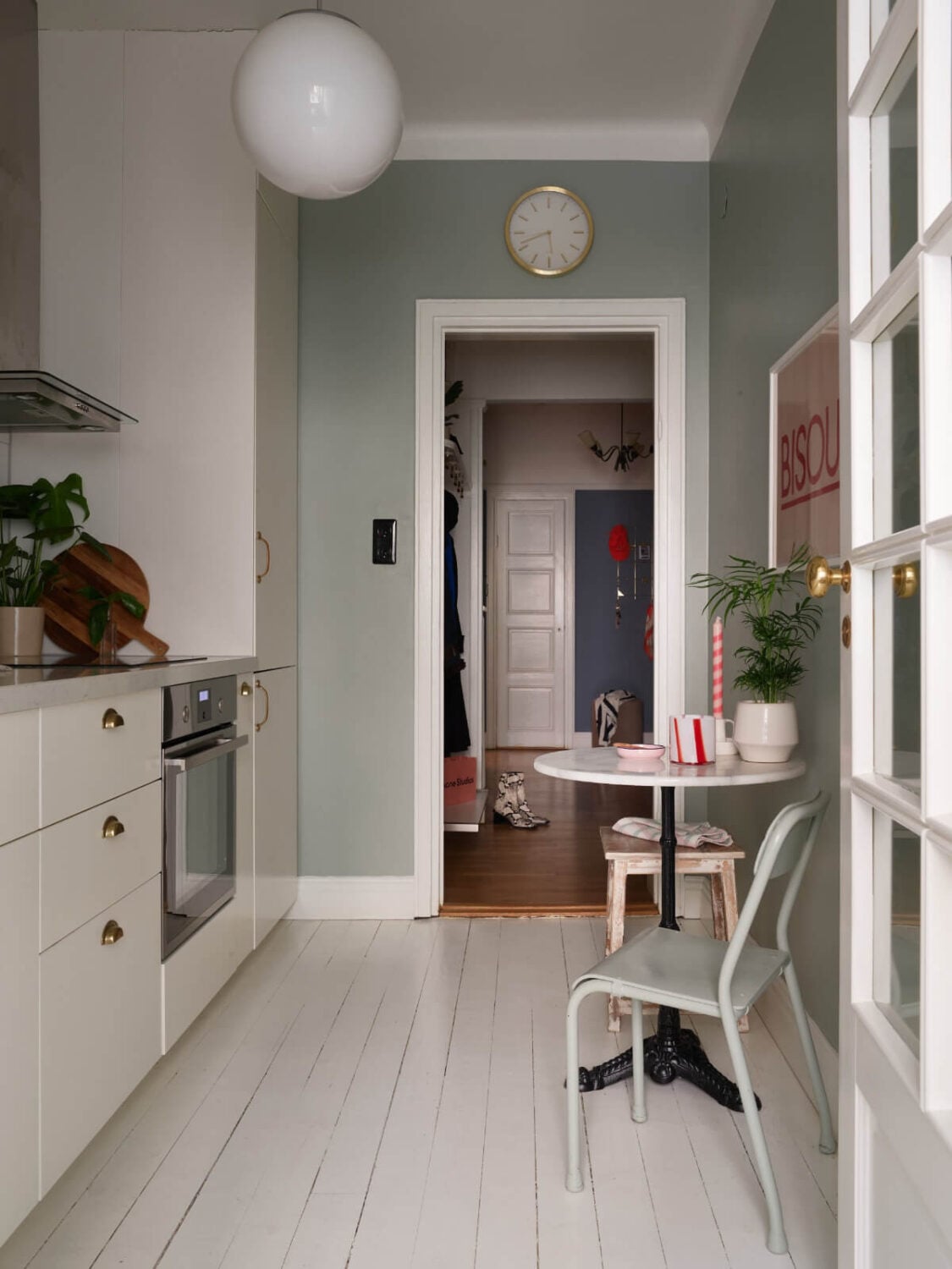 A Charming Small Apartment with a Fresh White Kitchen 8 kitchen gray-blue walls white-painted floorboards