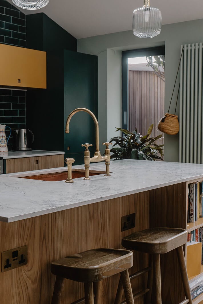 Moroccan-Inspired Designs in a Unique Artist Family Home in London 11 kitchen island copper sink