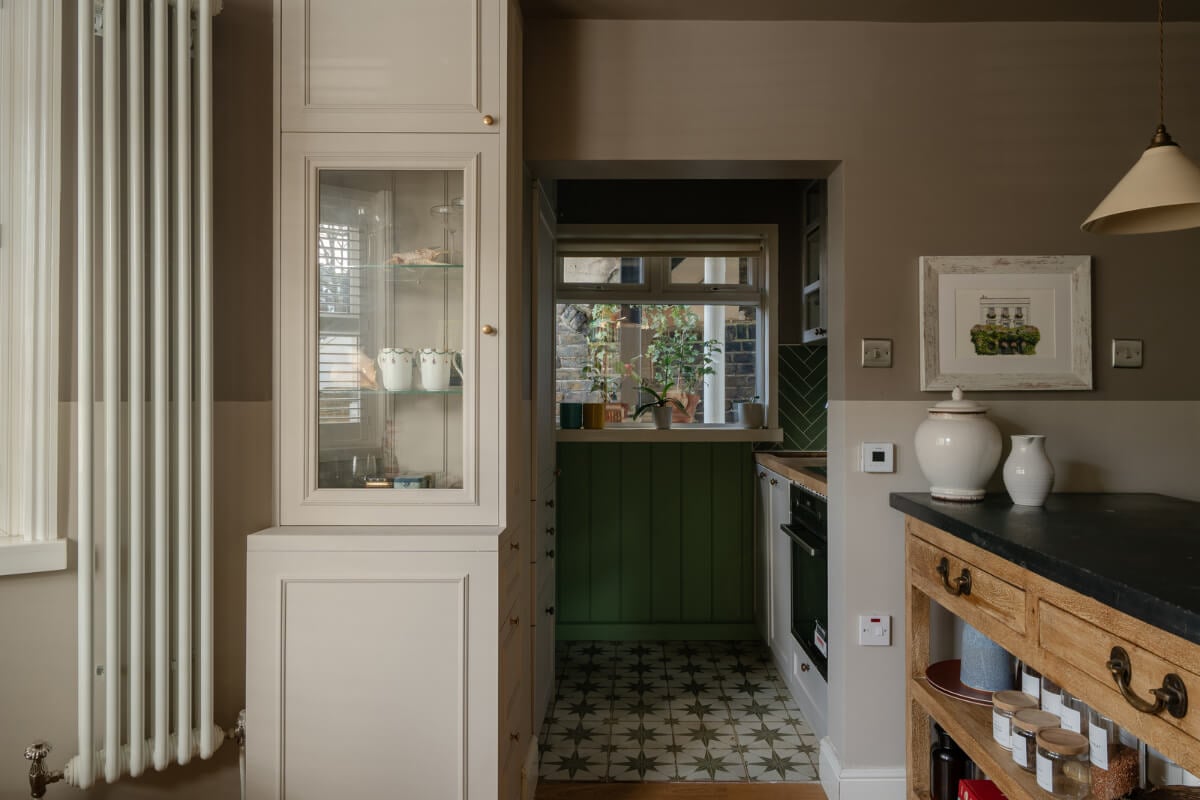 A Muted Color Palette in a Charming Ground Floor Apartment 8 kitchen niche manderin stone floor