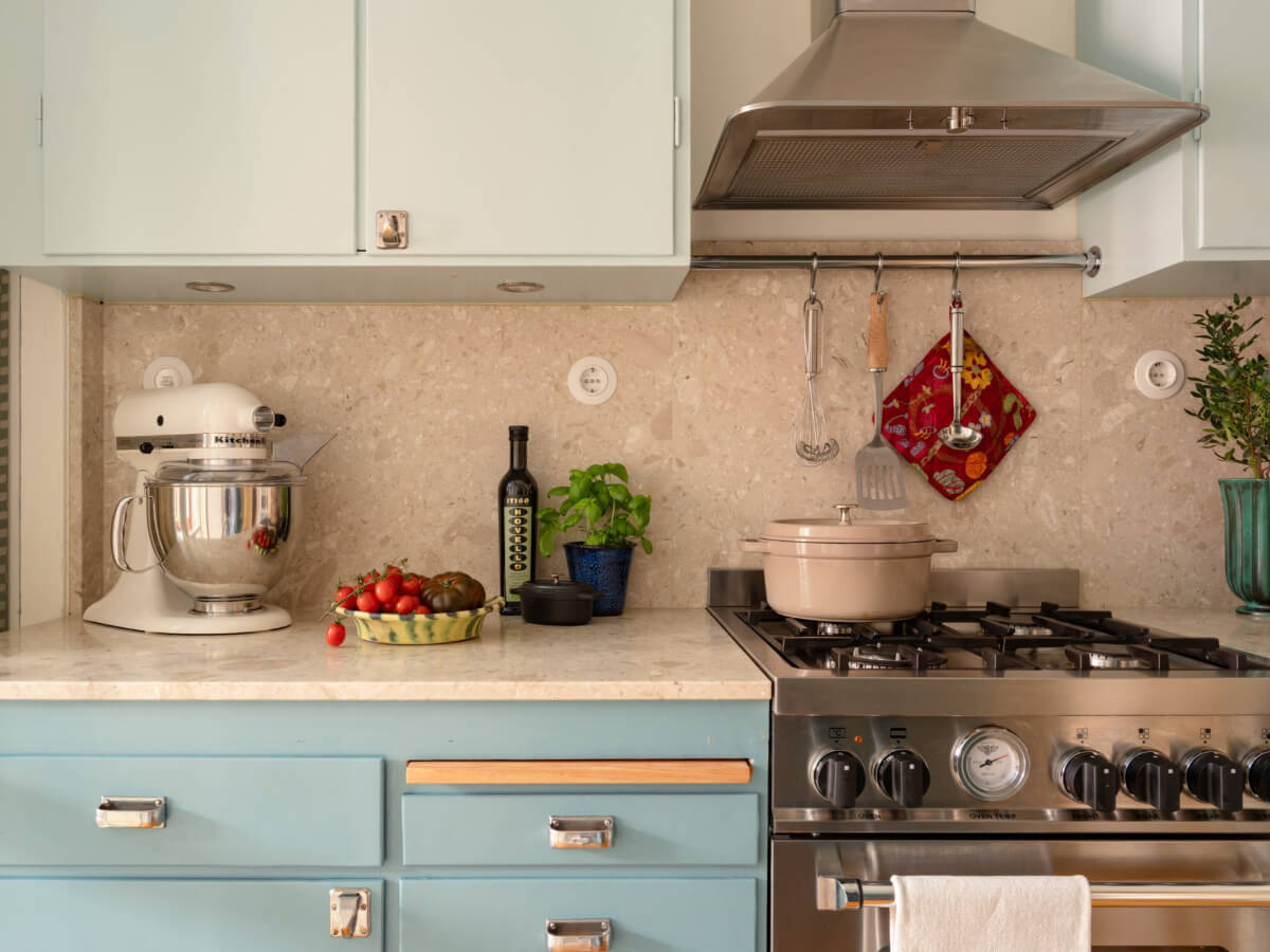 A Beautiful Well-Preserved 1930s Apartment with a Blue Kitchen 2 kitchen pale blue cabinets limestone countertop