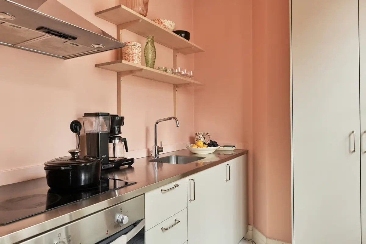 A Colorful Studio Apartment in Stockholm 11 kitchen pink walls A Colorful Studio Apartment in Stockholm