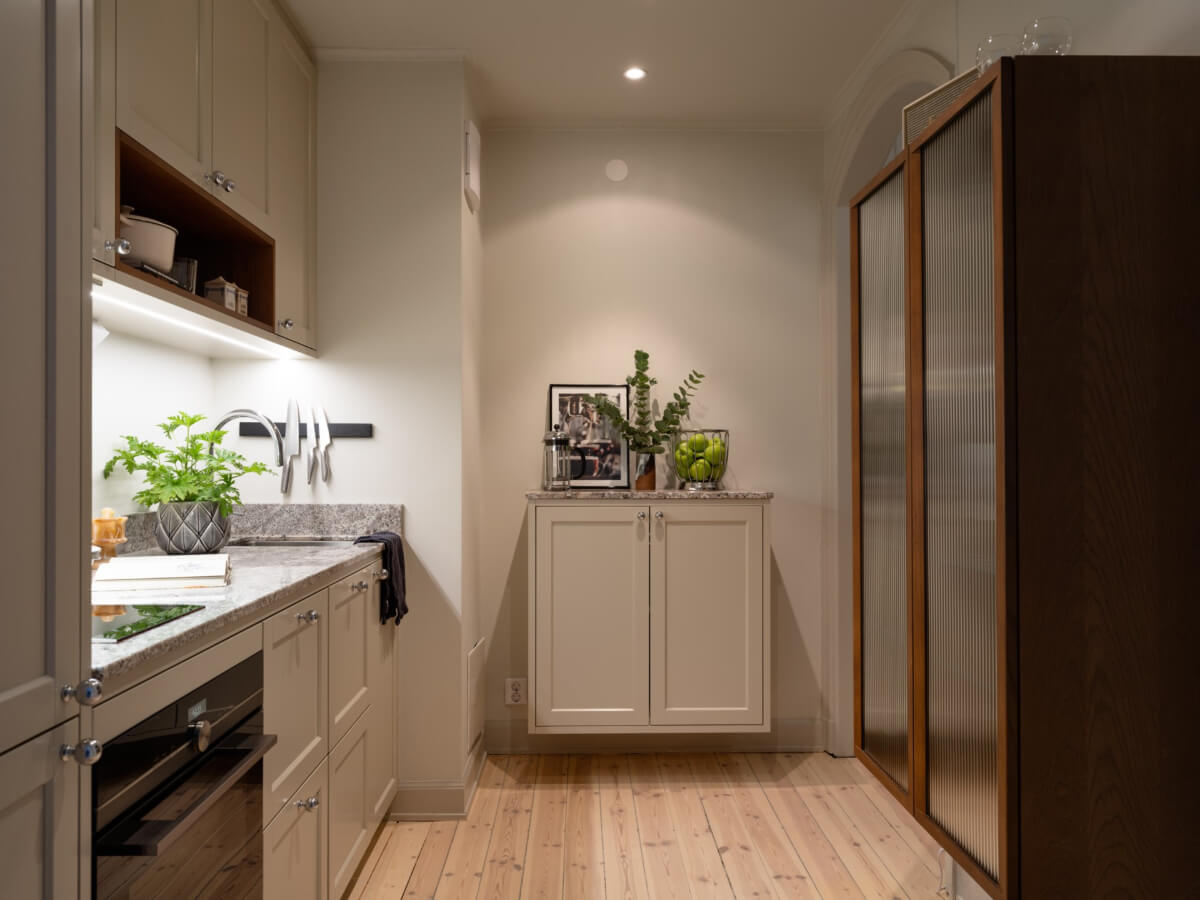 A Charming One-Bedroom Apartment in Södermalm 14 kitchen reeded glass wooden cabinet