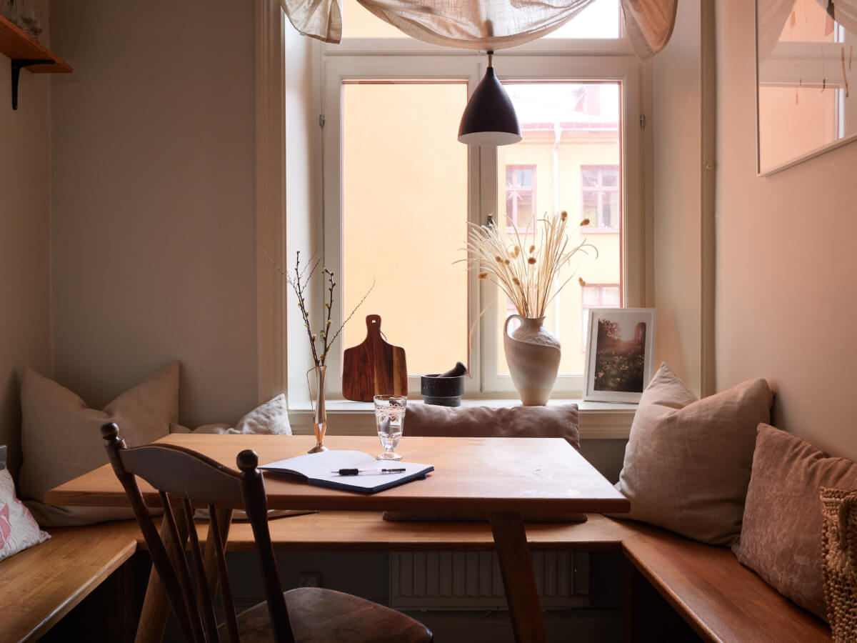 A Calm Gray Color Palette in a Charming Stockholm Apartment 12 kitchen seating bench