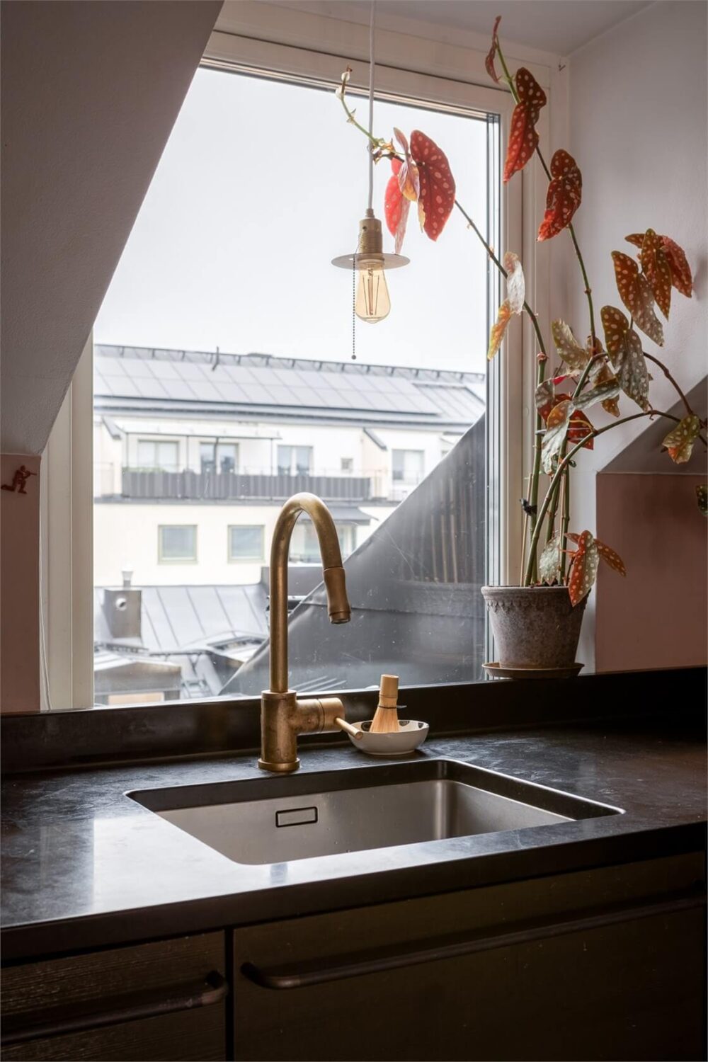 A Colorful Family Attic Apartment in Stockholm 19 kitchen sink and window