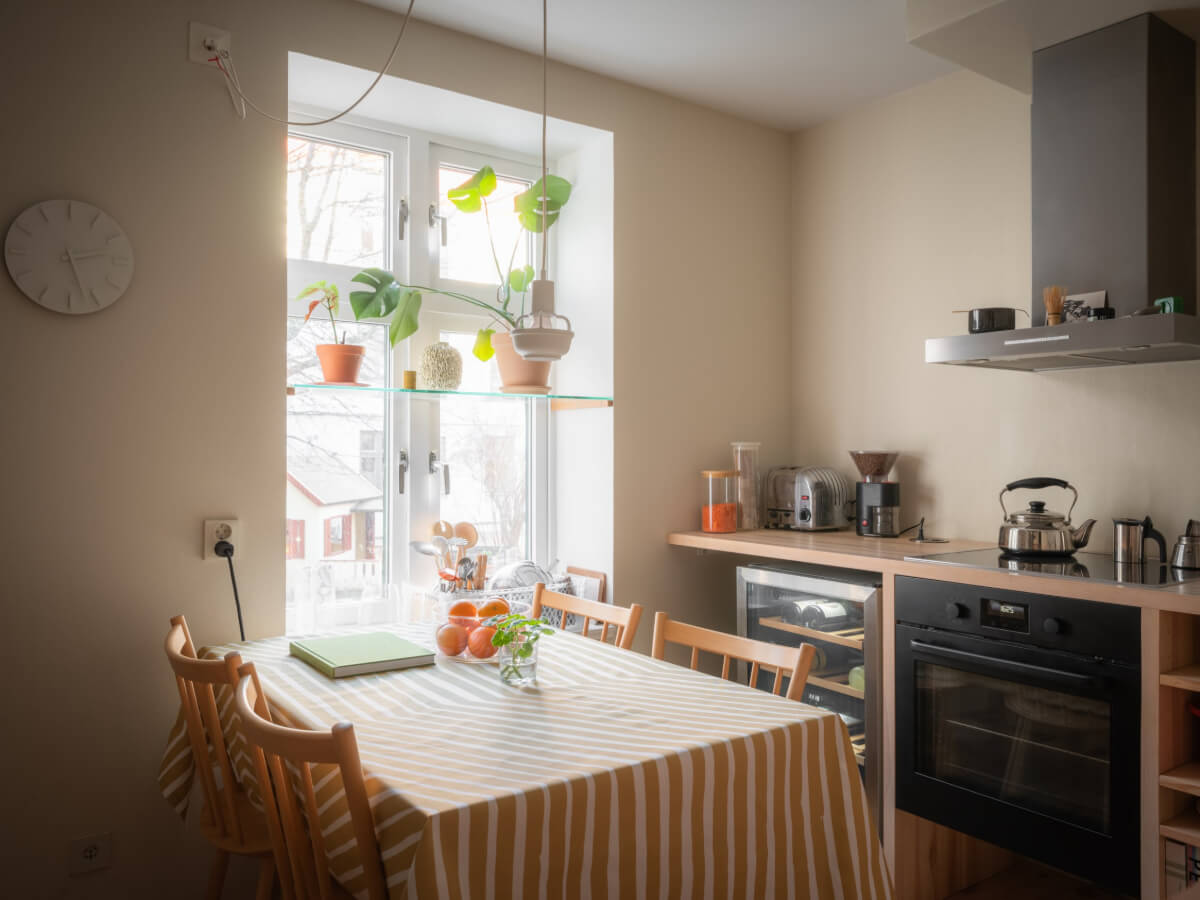 A Design Apartment in an Early 20th Century Building 9 kitchen table striped tablecloth