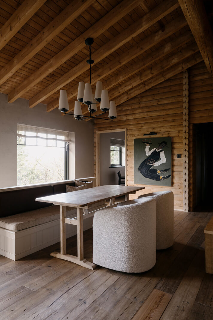 A Cozy and Contemporary Take on a Traditional Log House 9 kitchen table with wooden bench