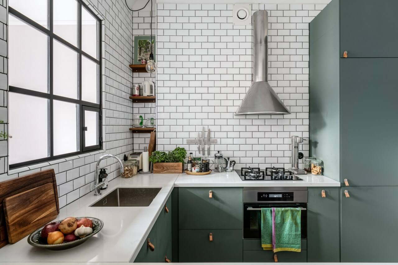 A Small Light-Filled Apartment with a Pink Bedroom 12 kitchen tiny niche wooden shelves