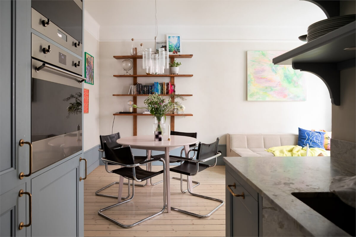 A Small Stockholm Apartment with a Blue Shaker Kitchen 12 kitchen view into living space