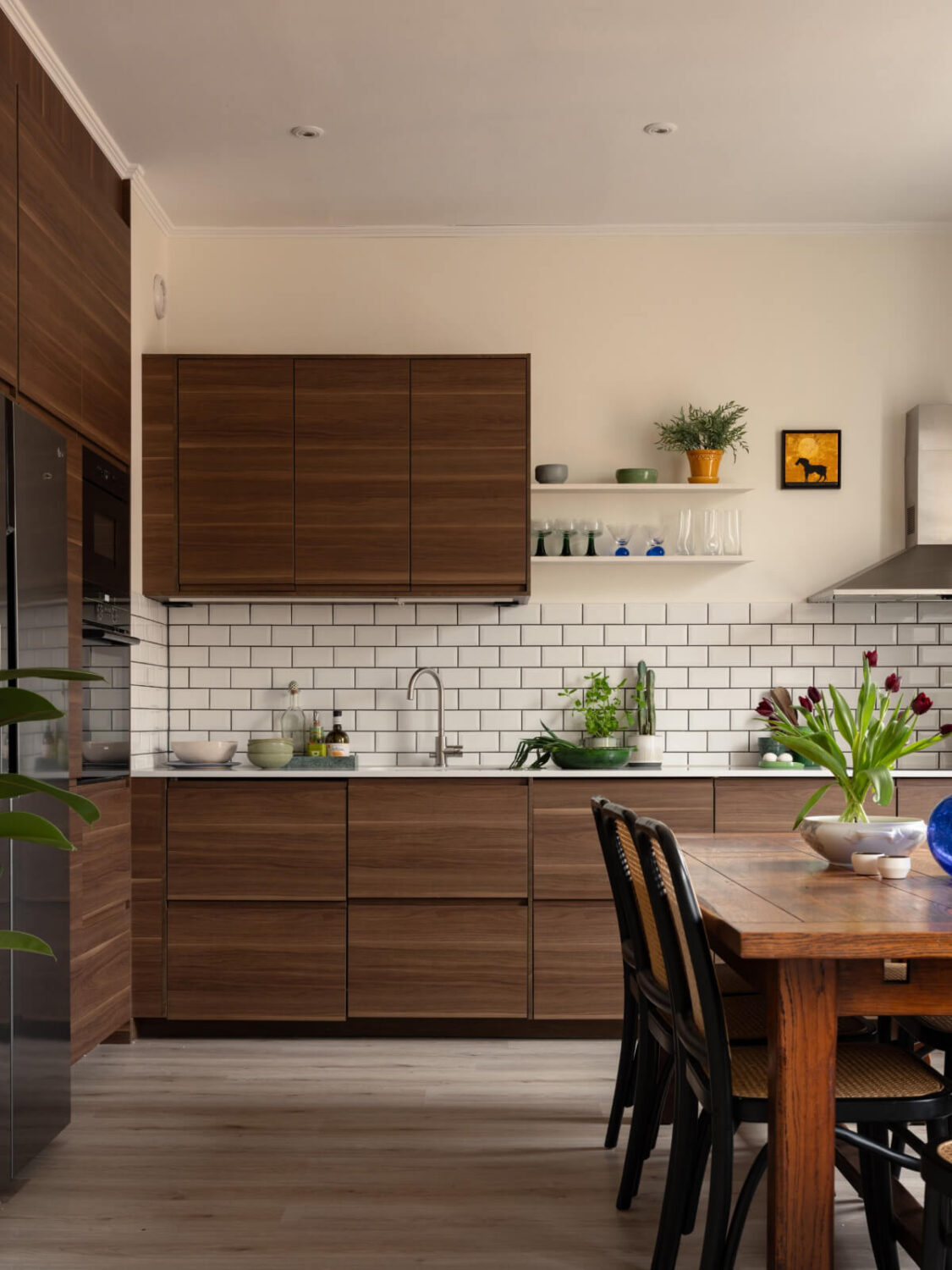 A Pink and Orange Bedroom in a Light Stockholm Apartment 12 kitchen white backsplash tiles