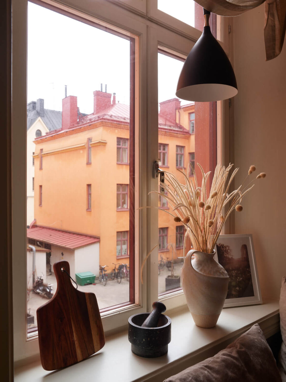 A Calm Gray Color Palette in a Charming Stockholm Apartment 13 kitchen window