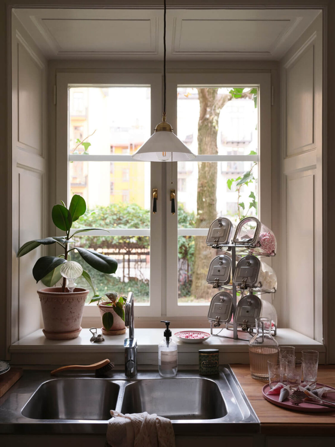 A Charming Vintage Apartment with Historic Wallpapers in Stockholm 8 kitchen window