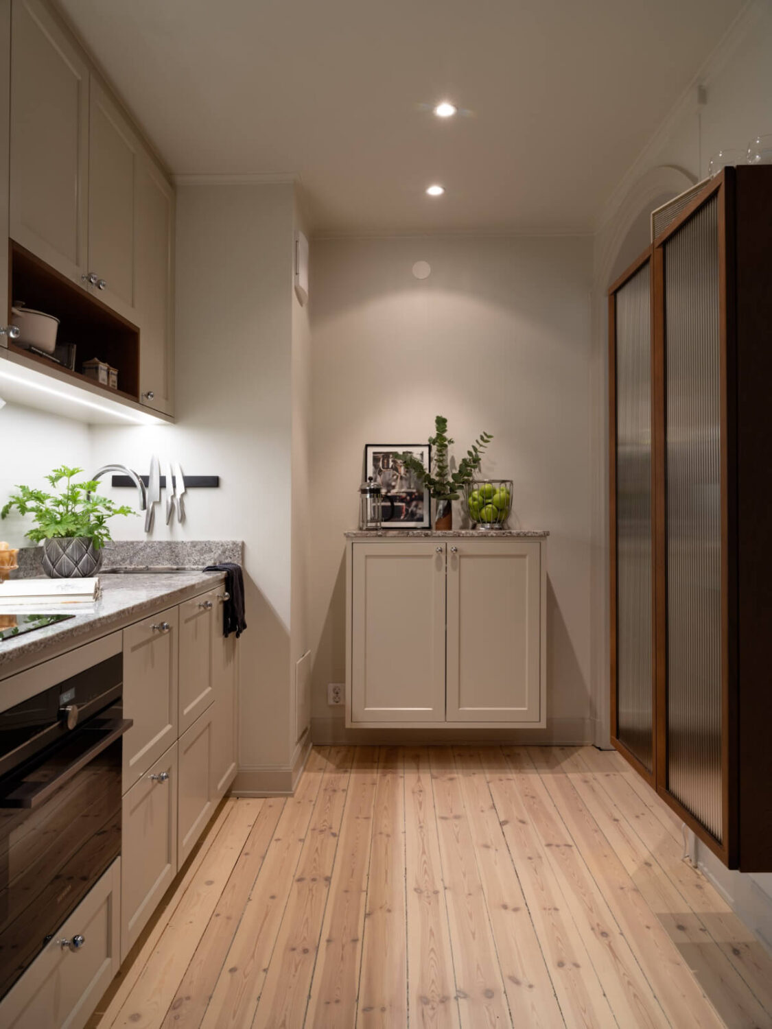 A Charming One-Bedroom Apartment in Södermalm 16 kitchen with open cabinet wooden floo