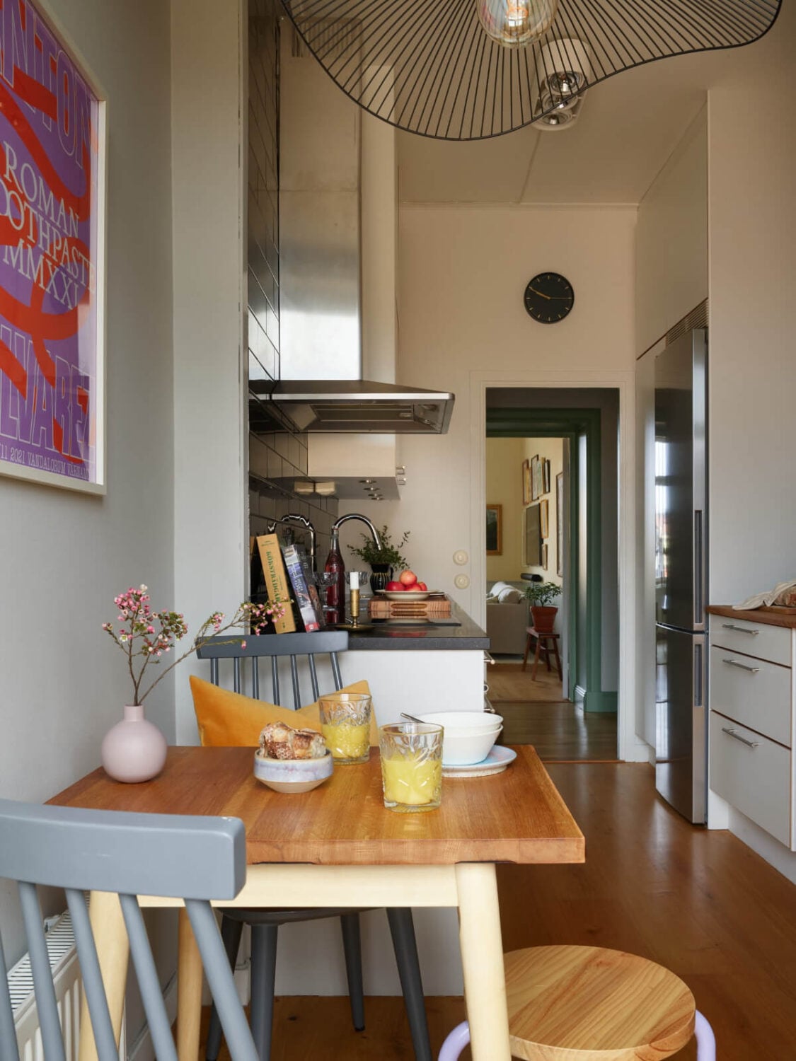 Lovely Color Combinations in a Charming One-Bedroom Apartment 14 kitchen with small table