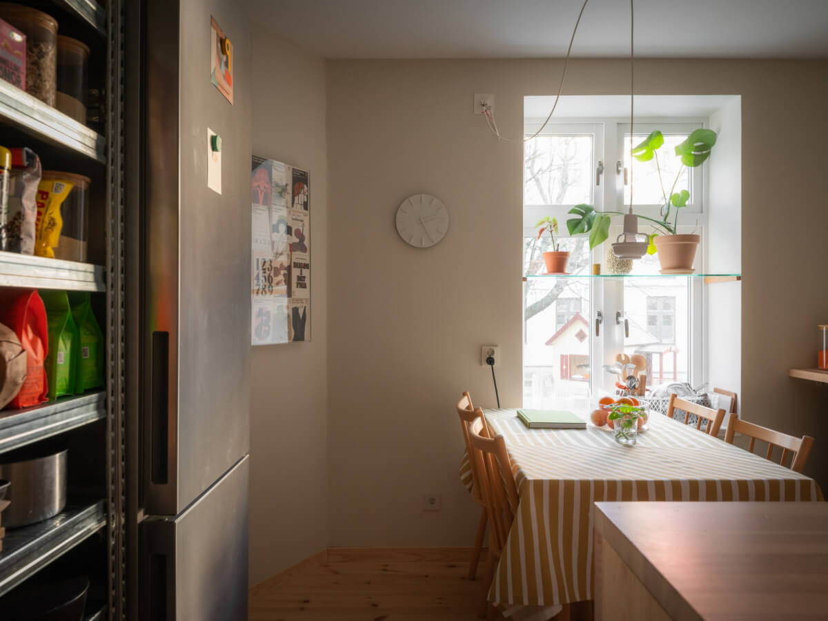 A Design Apartment in an Early 20th Century Building 15 kitchen with table and shelf in front of window