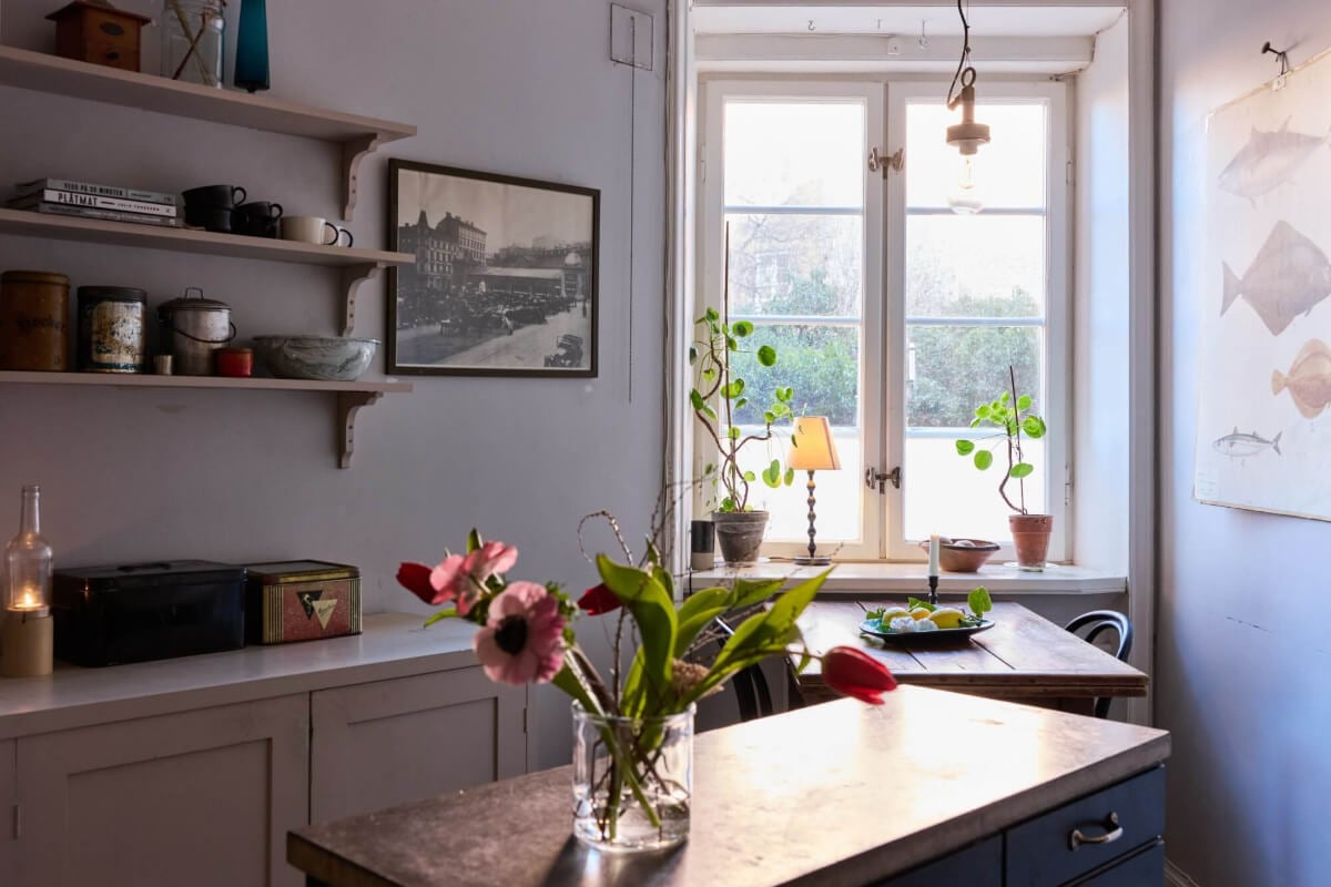 A Charming Apartment with Period Details in Malmö 14 kitchen with table under window