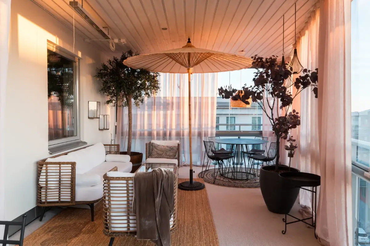A Top Floor Swedish Apartment with a Huge Balcony 23 large terrace with table and seating area