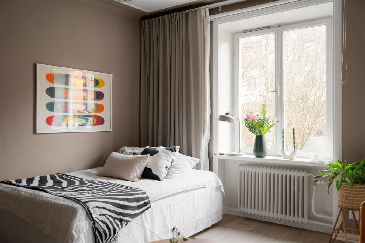 A Studio Apartment with Brown Walls 5 large window brown studio