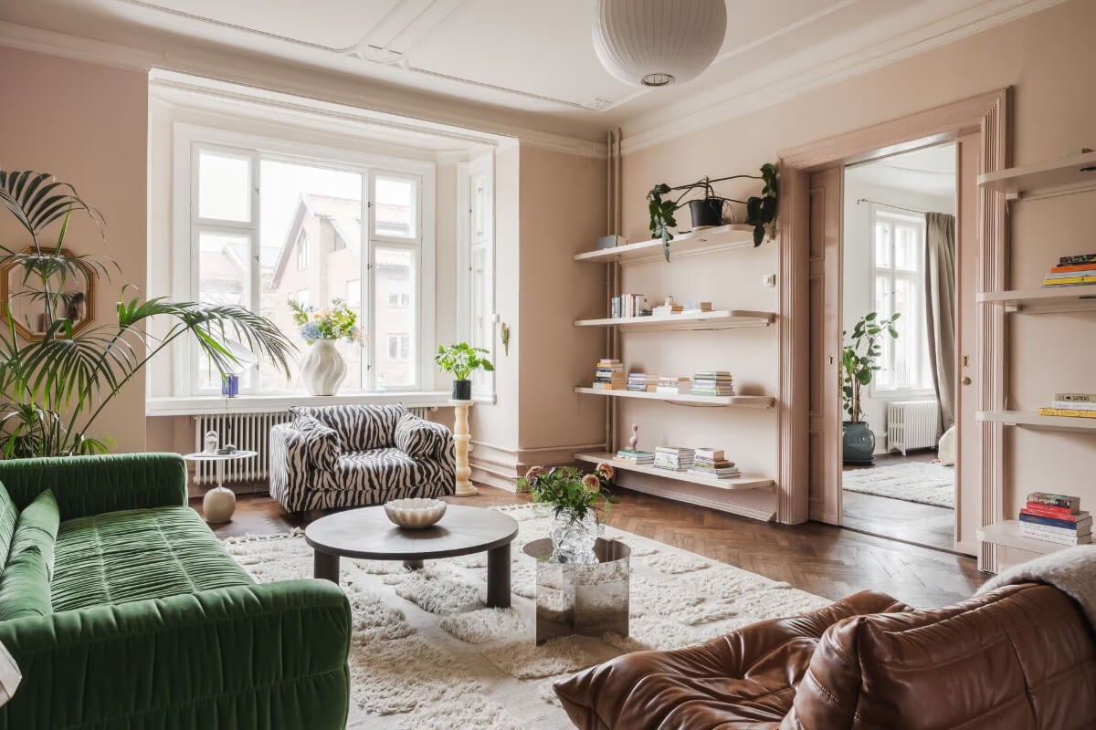 Grand Rooms and Period Features in a Malmö Apartment 3 large window pink living room shelves