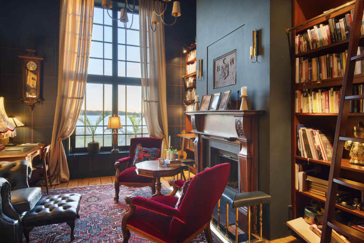 English Manor Style Interiors in a New Swedish Home with Lake Views 6 library room with fireplace