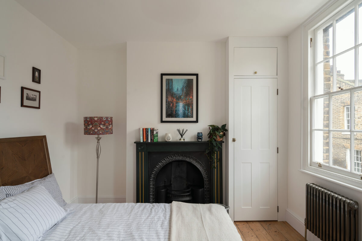 A Renovated Georgian House with an Extended Kitchen 18 light bedroom black fireplace