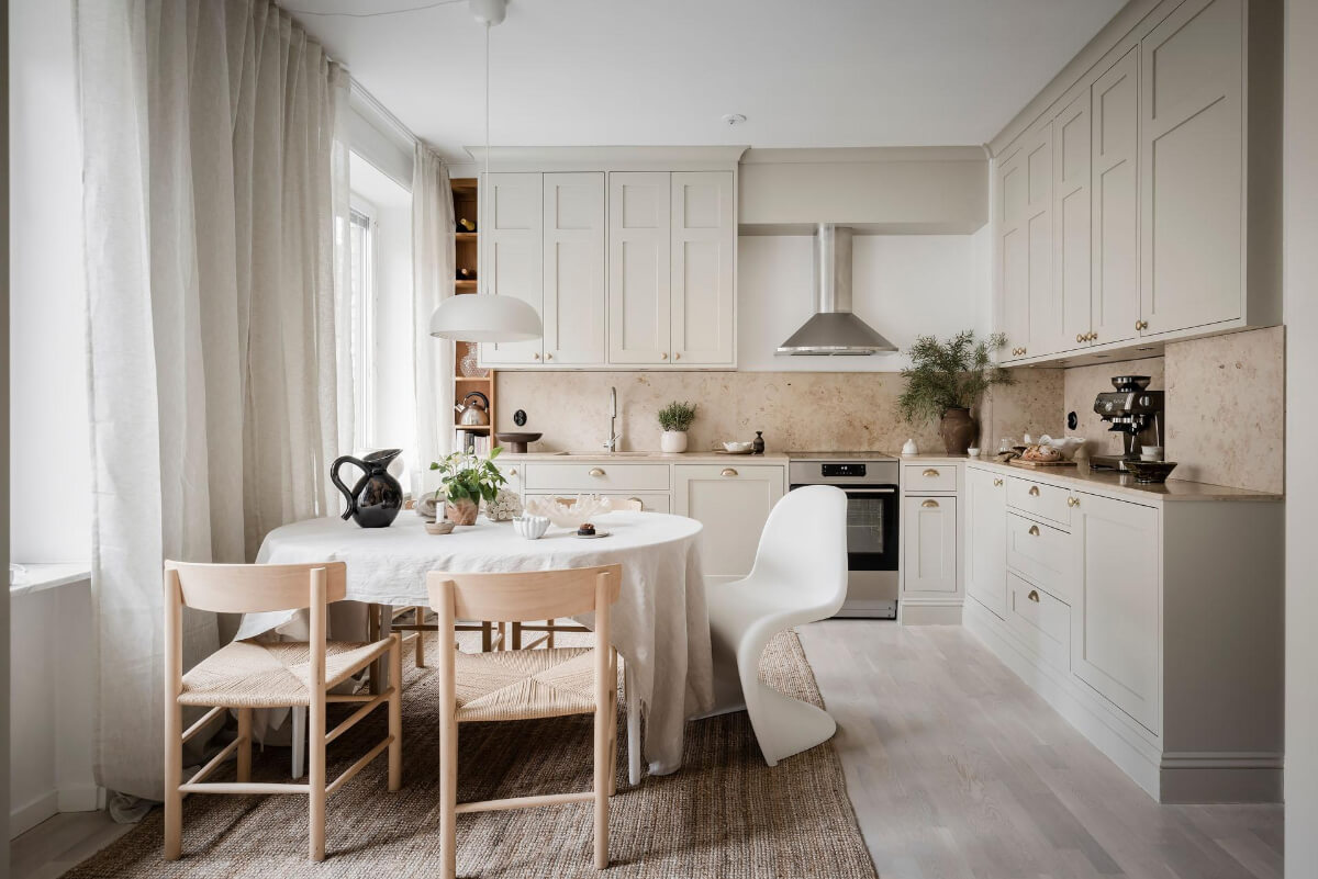 A Light Corner Apartment with an Open Flowing Floor Plan 7 light colored classic kitchen brass fittings