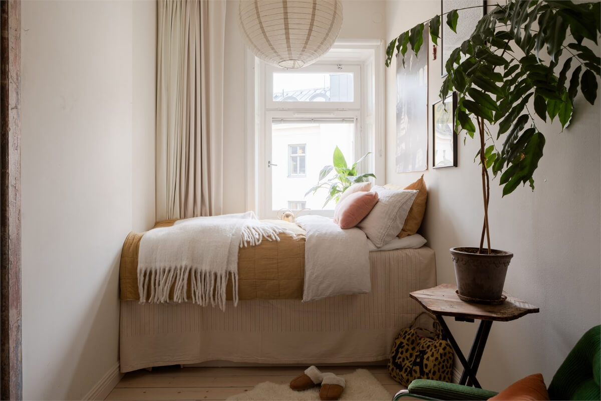 A Colorful Family Attic Apartment in Stockholm 38 light colored narrow bedroom