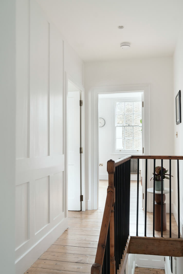 A Renovated Georgian House with an Extended Kitchen 16 light first floor landing wooden floor