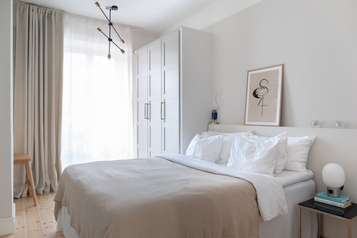 A Small Apartment Decorated in a Light Gray & White Color Palette 13 light gray bedroom wardrobes ledge headboard