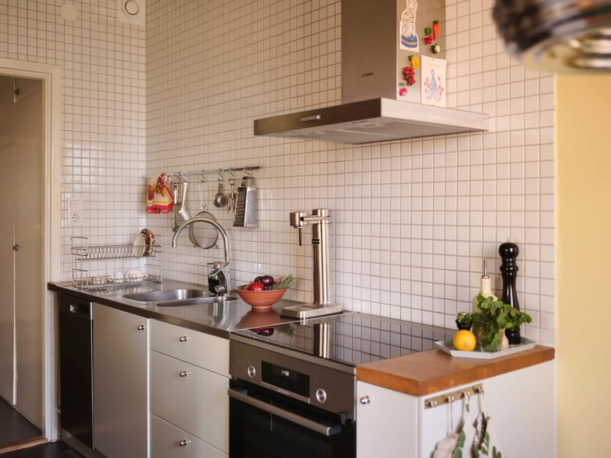 A Light Corner Apartment with Yellow Color Accents 17 light gray kitchen small white tiles