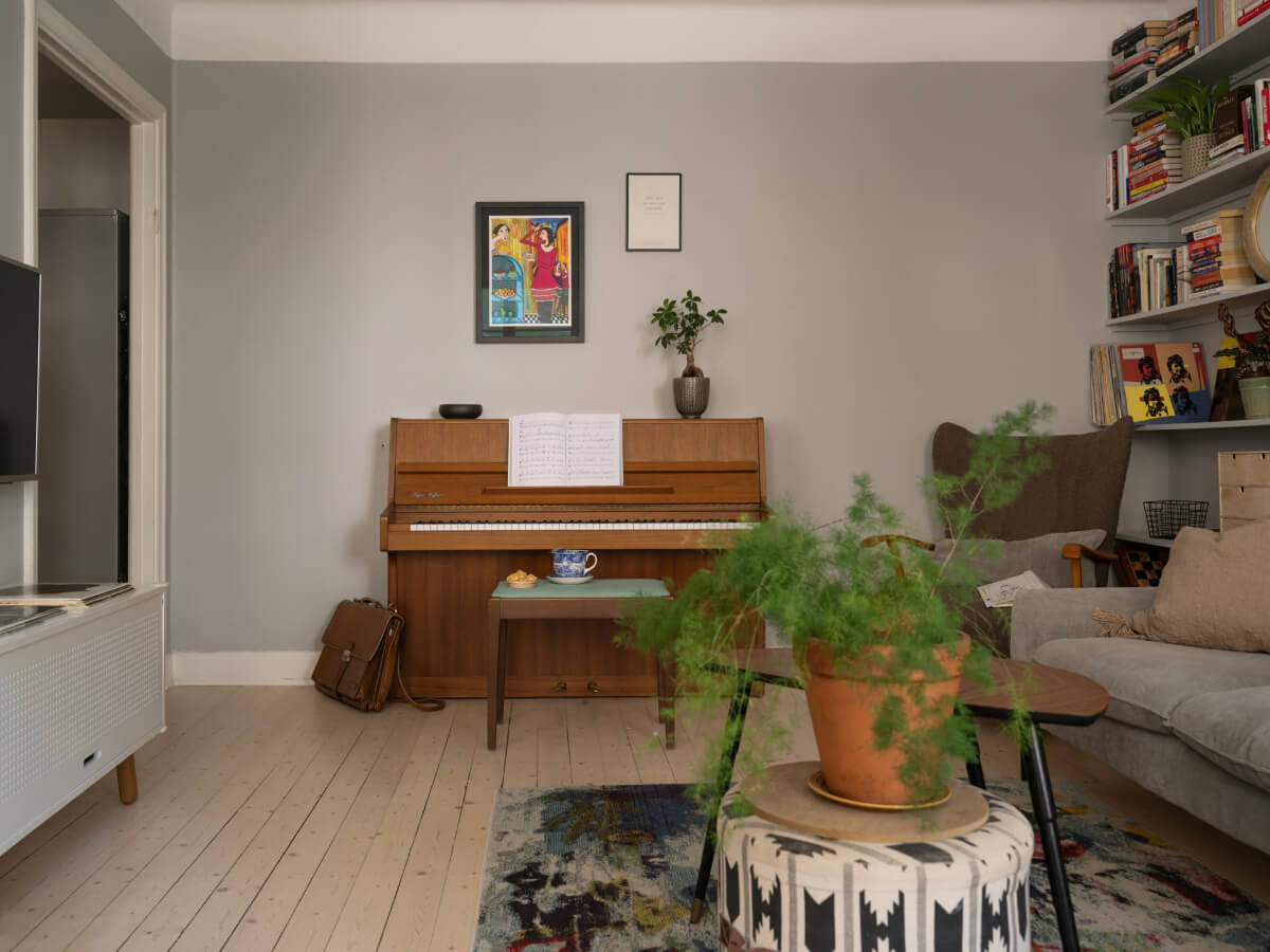 A Charming One-Bedroom Apartment in a 1920s Building 4 light gray living room light wooden floor