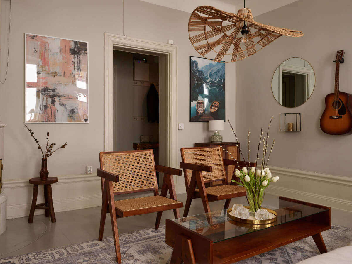 A Calm Gray Color Palette in a Charming Stockholm Apartment 5 light gray walls high baseboards