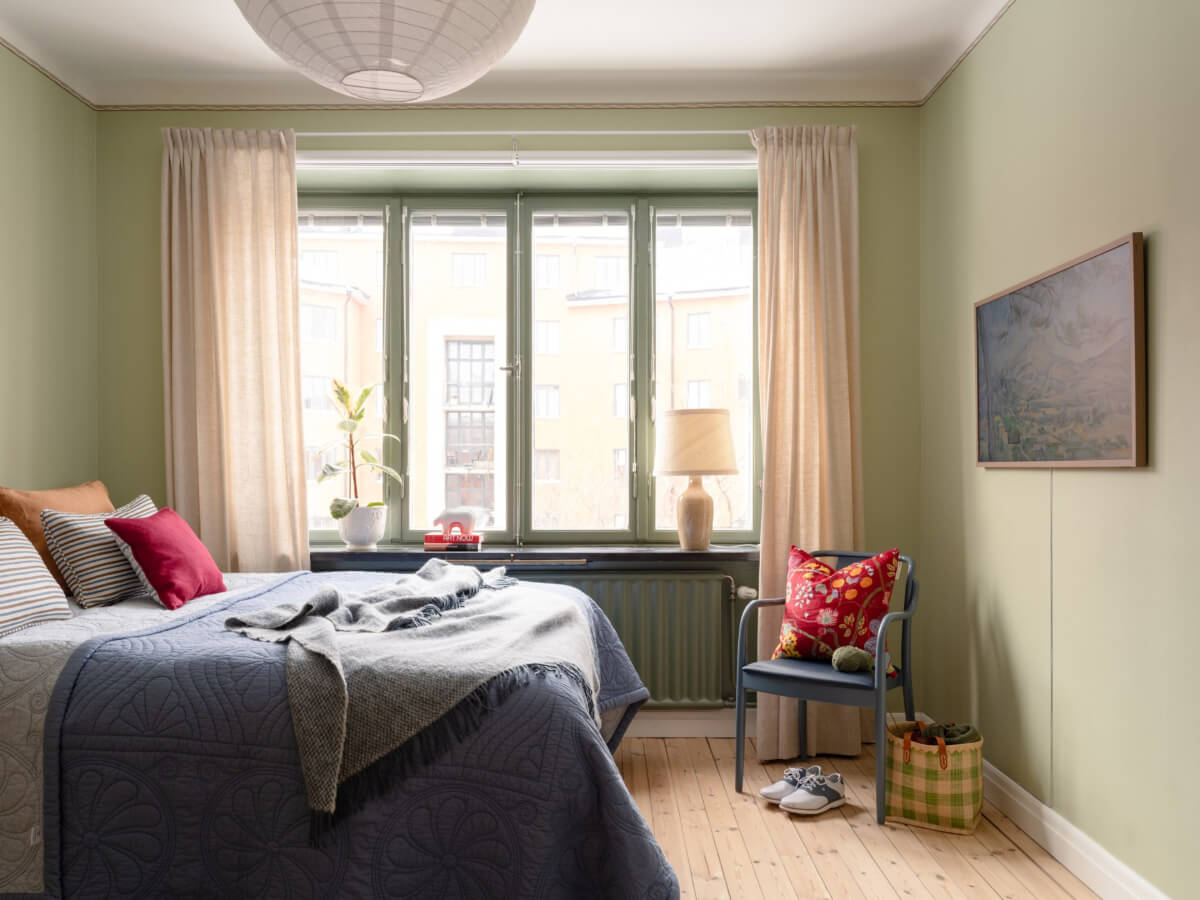A Beautiful Well-Preserved 1930s Apartment with a Blue Kitchen 16 light green bedroom