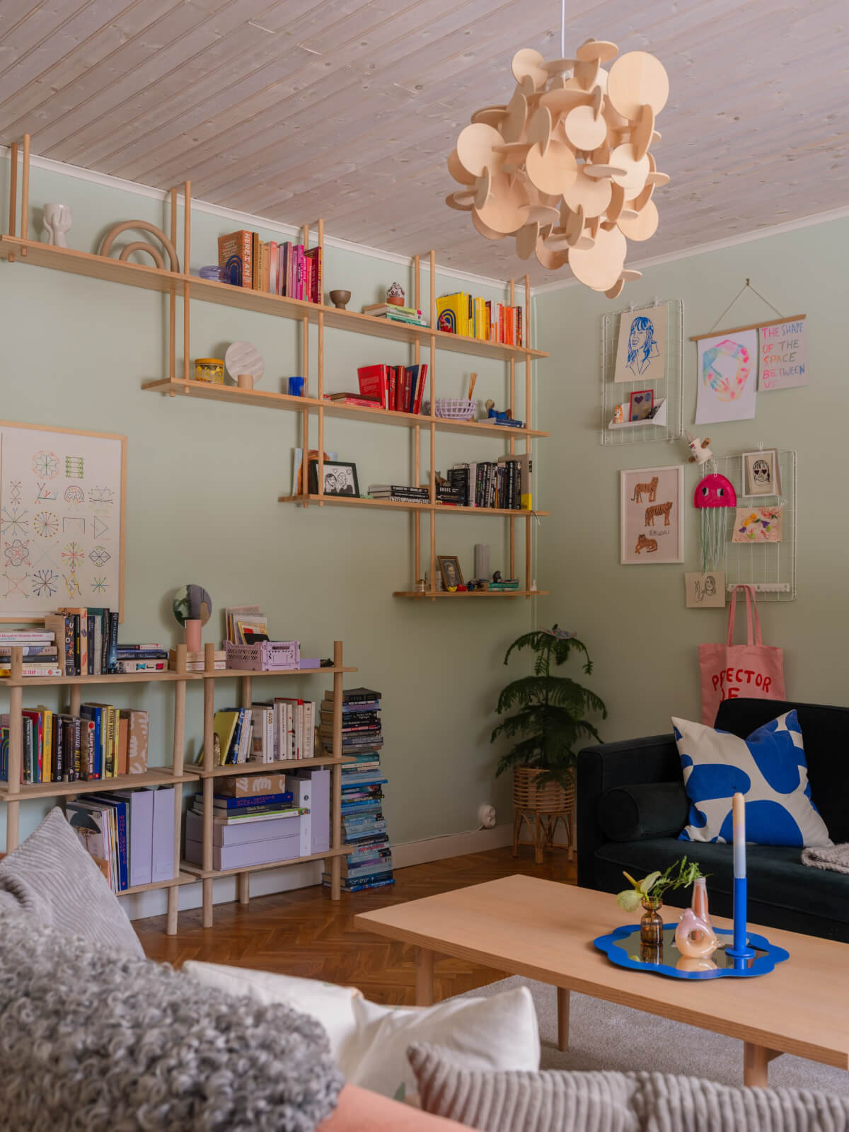 light green living room with bookshelves