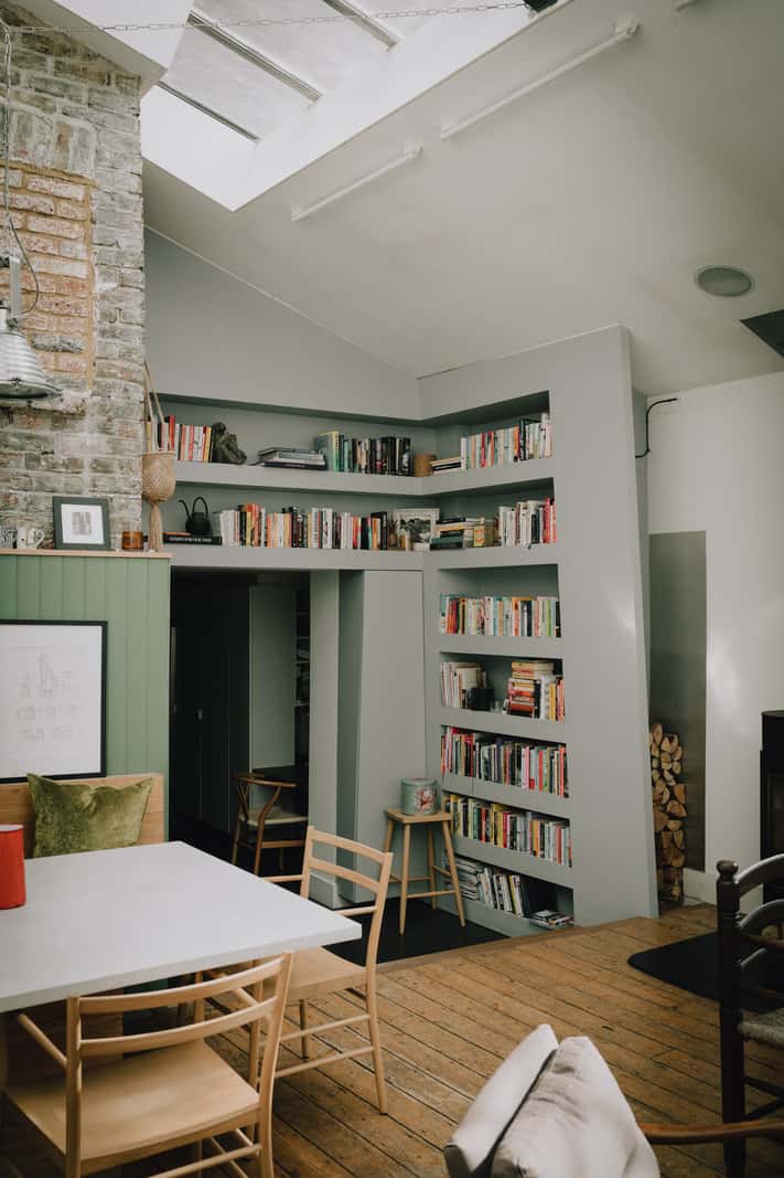 A London Basement Apartment in a Former Wood Workshop 3 living area built-in bookshelves