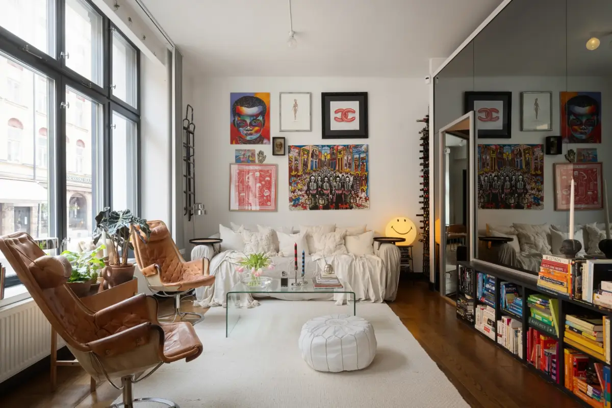 An Apartment with a Mirror Wall in a Former Stockholm Factory 1 living room black glass wall