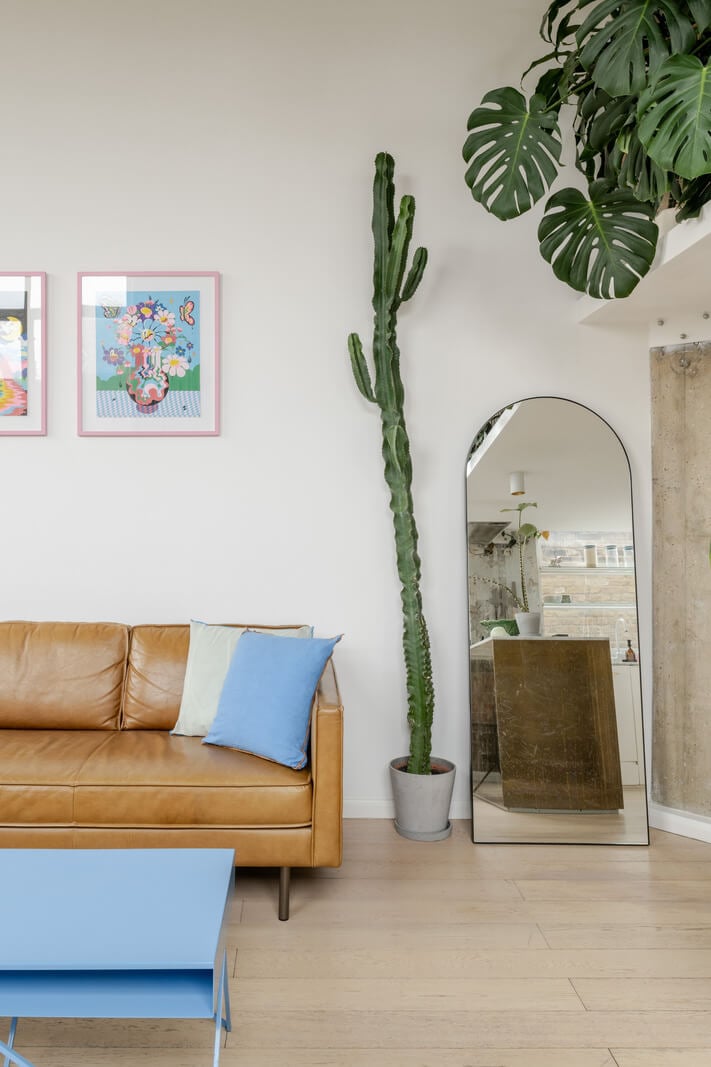 A Plant-Filled Loft Apartment in a Former Clothing Factory 5 living room blue coffee table A Plant-Filled Loft Apartment in a Former Clothing Factory