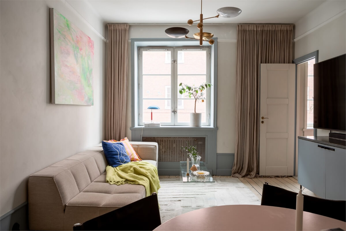 A Small Stockholm Apartment with a Blue Shaker Kitchen 2 living room blue-gray woodwork