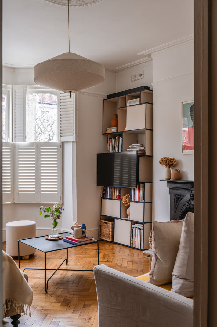 A Charming Garden Apartment in a Victorian House 2 living room bookcase in niche