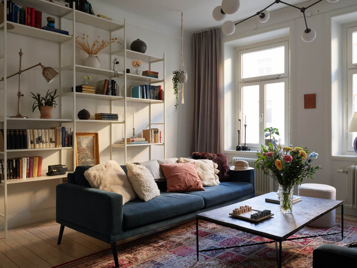 A Two-Bedroom Apartment with a Charming Bathroom 1 living room bookshelves