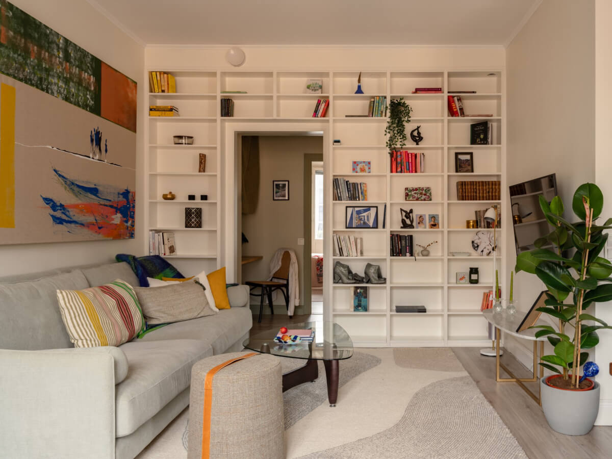 A Pink and Orange Bedroom in a Light Stockholm Apartment 6 living room built-in bookcases