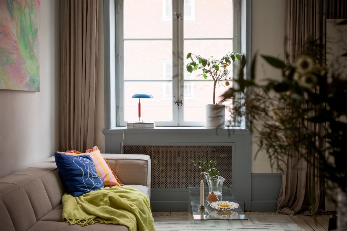 A Small Stockholm Apartment with a Blue Shaker Kitchen 4 living room clear coffee table