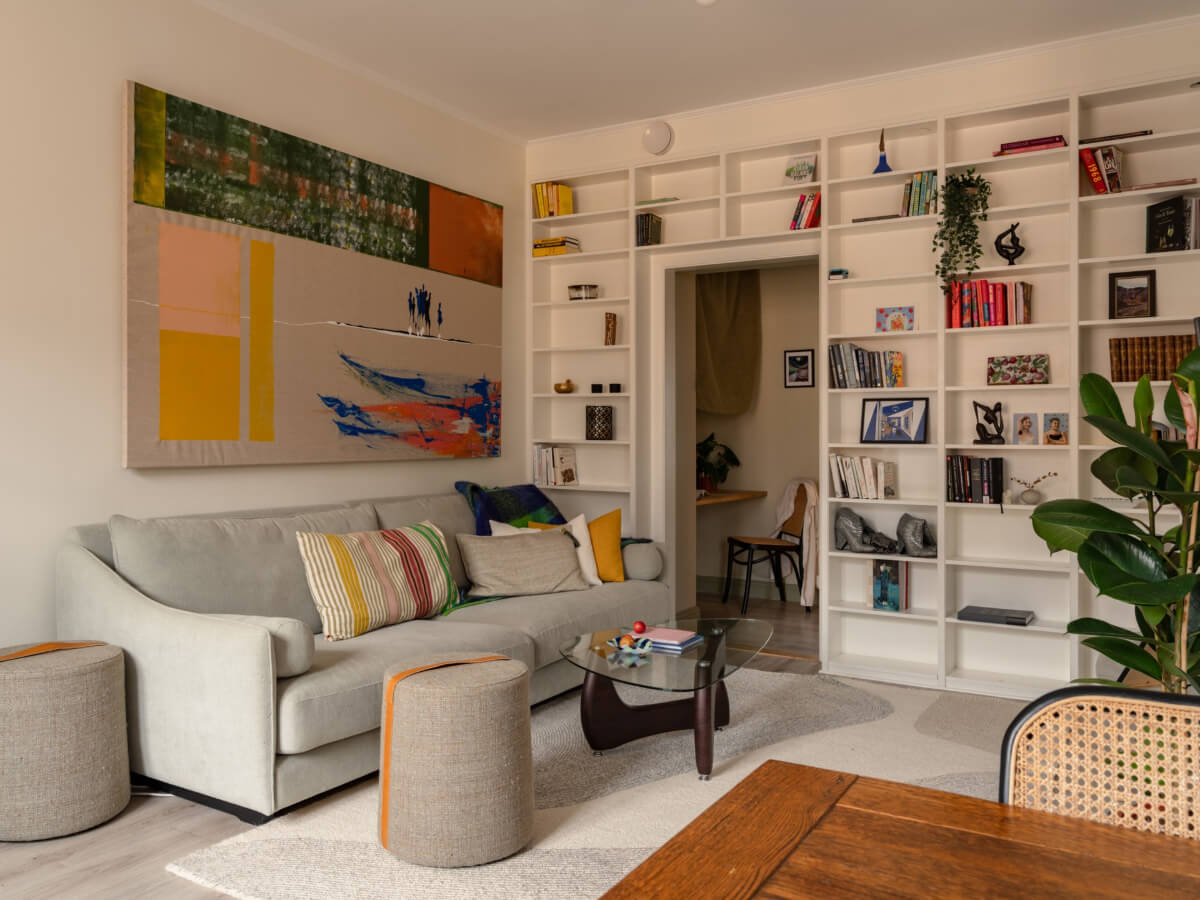 A Pink and Orange Bedroom in a Light Stockholm Apartment 3 living room colorful art