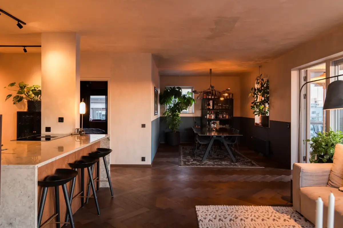 A Top Floor Swedish Apartment with a Huge Balcony 11 living room evening two tone walls