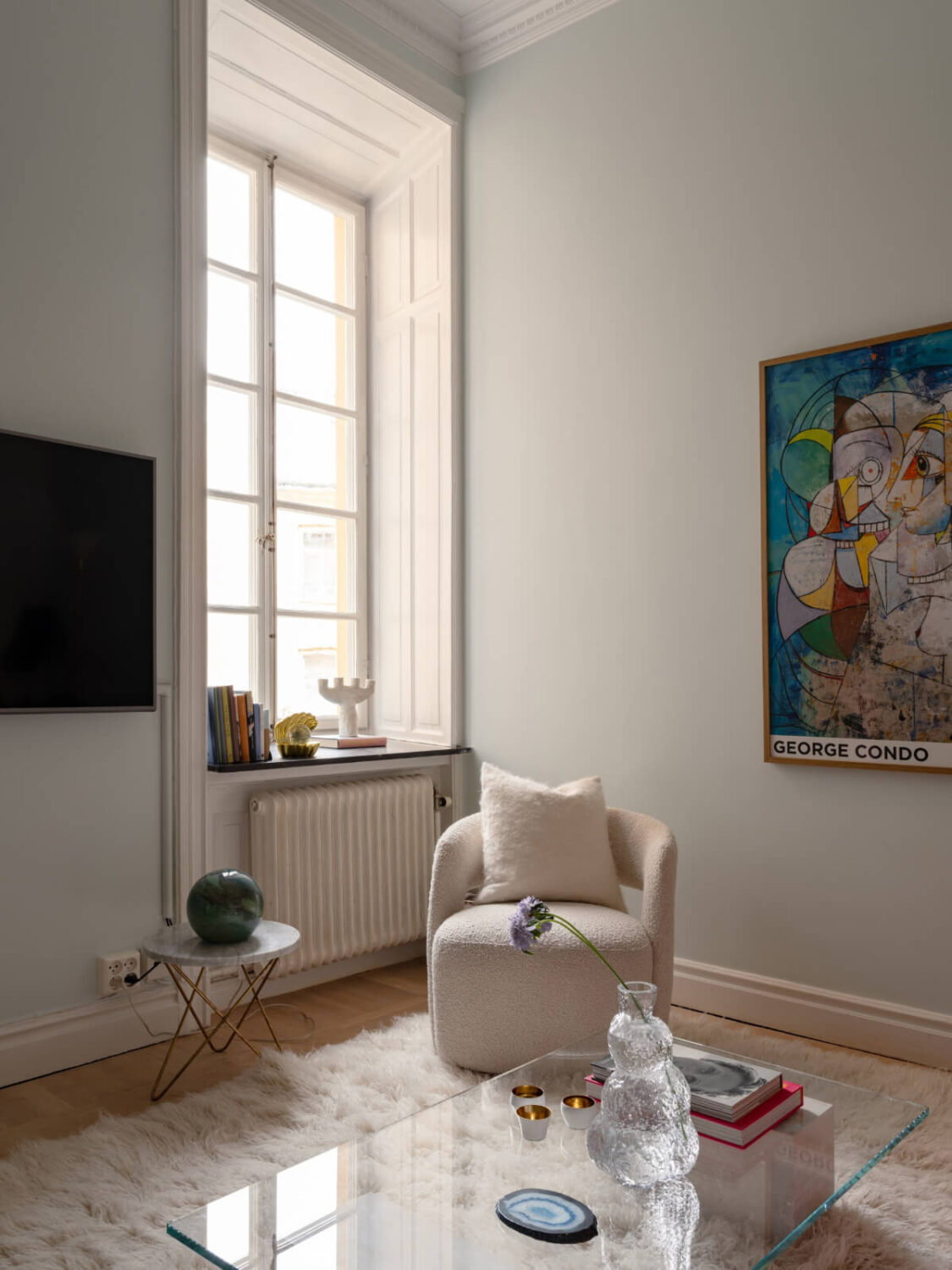 A Small Pink and Blue Apartment with High Ceilings in Stockholm 6 living room large window deep window sill