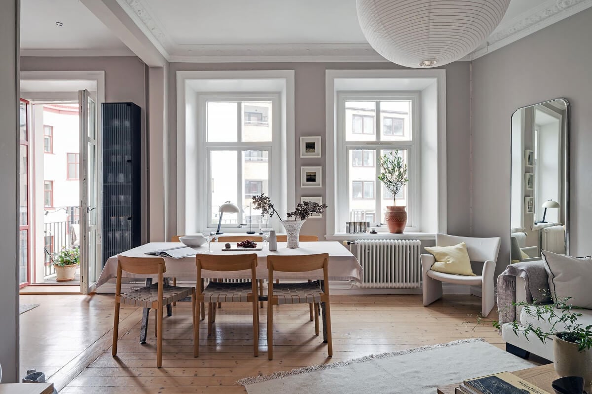 A Gothenburg Apartment with a Small Dark Green Bedroom 8 living room large windows wooden floor gray walls