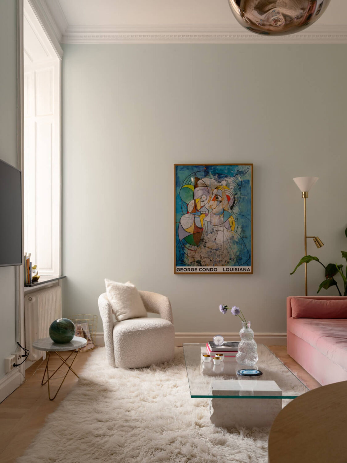 A Small Pink and Blue Apartment with High Ceilings in Stockholm 4 living room light blue-gray walls high ceiling pink sofa