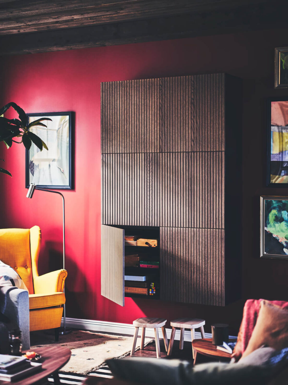 The 2026 Color of the Year (with Color Palettes & Inspiration) 29 living room reddish pink wall brown wooden cabinet nordroom