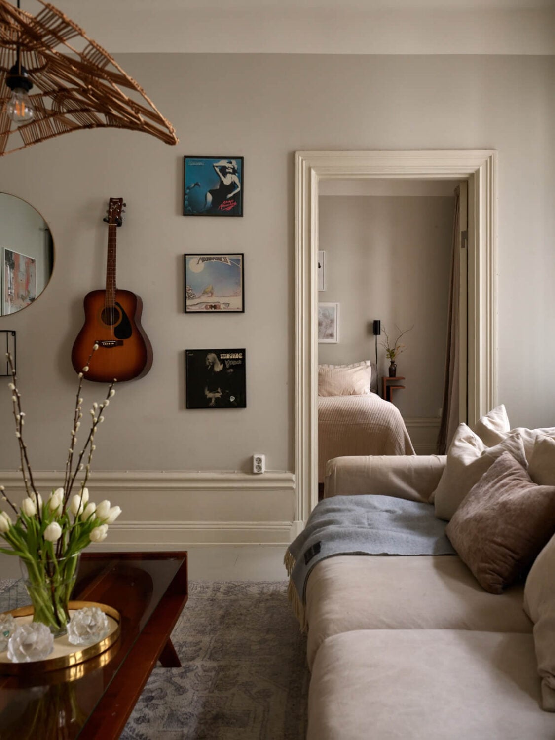 A Calm Gray Color Palette in a Charming Stockholm Apartment 6 living room view into bedroom